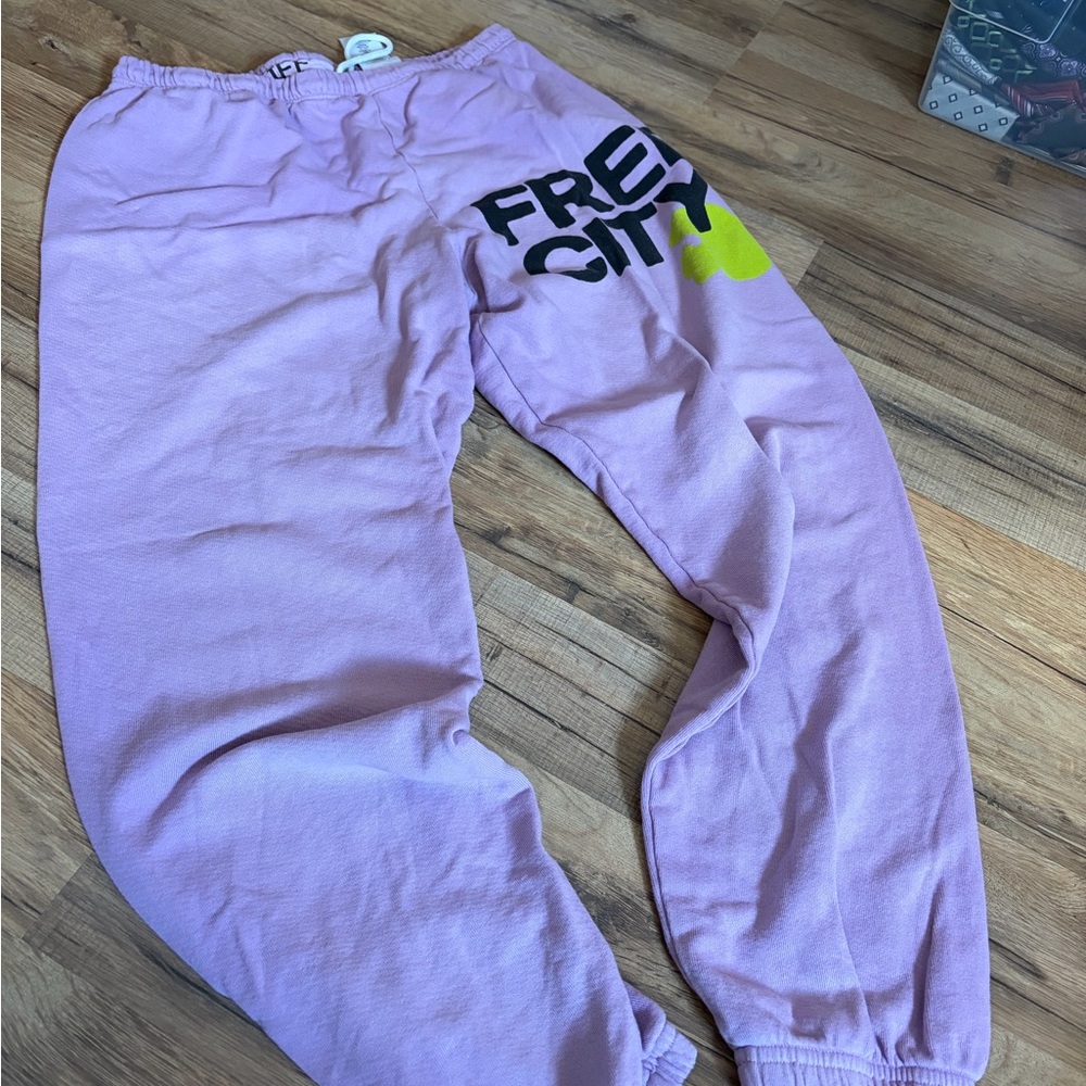 freecity Lavender Sweatpants with Black Logo and Neon Yellow Accent